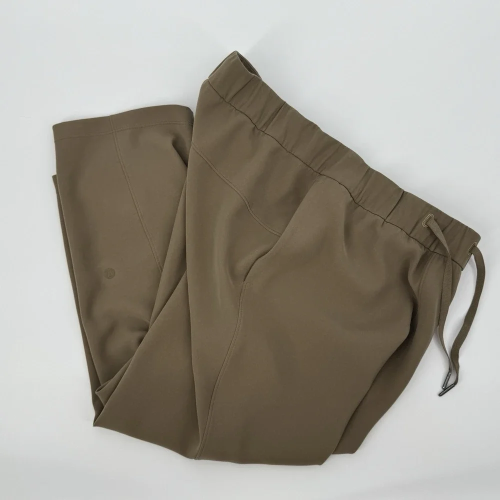 Lululemon‎ On The Fly Crop Pants Size 10 Khaki Woven Drawstring Stretch Casual